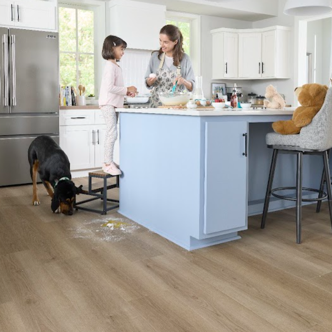 Mother and daughter baking together in a kitchen with waterproof Pergo Flooring