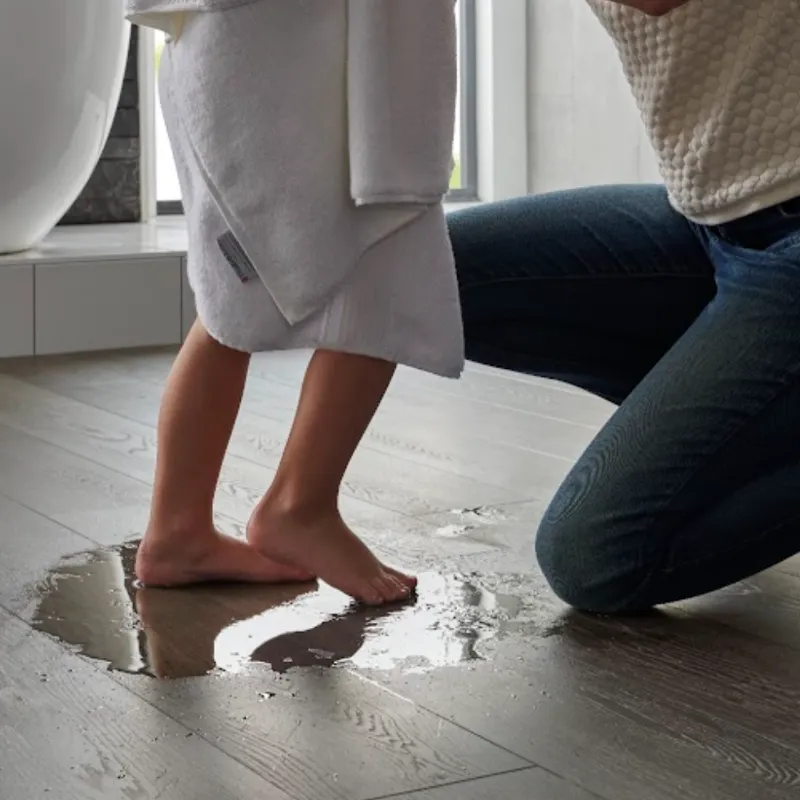 Mother and child in a bathroom with waterproof flooring