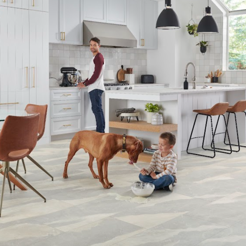 Child and dog playing on a durable Versatech floor in a family home