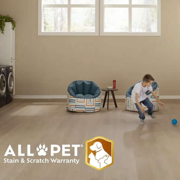 Mohawk Flooring All Pet Ad featuring a child and dog playing in an open room