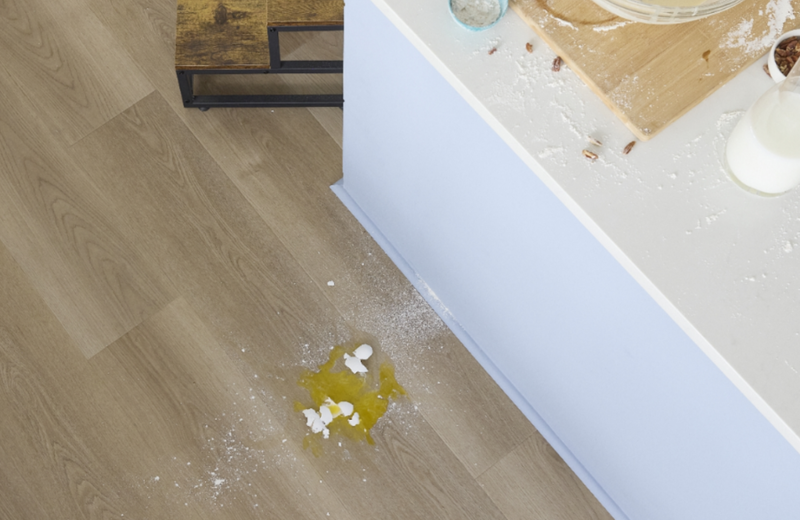 Baking on a countertop in a kitchen with waterproof flooring by Pergo